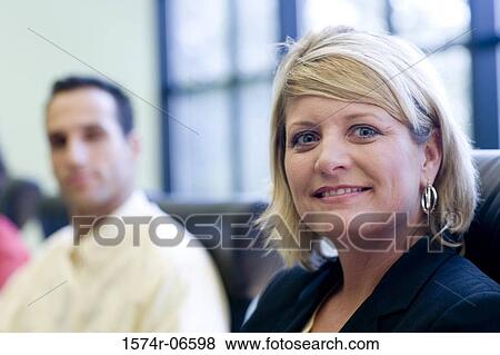 Portrait of a businesswoman smiling in an office View Large Photo Image Stock Photo - Portrait of a businesswoman smiling in an office. Fotosearch