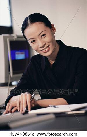 Stock Image - Portrait of a businesswoman smiling. Fotosearch