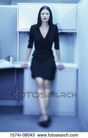 Portrait of a businesswoman standing in an office View Large Photo Image Stock Image - Portrait of a businesswoman standing in an office. Fotosearch