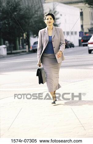 Portrait of a businesswoman walking on the street View Large Photo Image Stock Photography - Portrait of a businesswoman walking on the street. Fotosearch