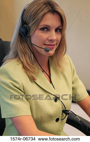 Picture - Portrait of a businesswoman wearing a headset. Fotosearch