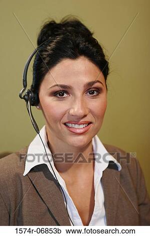 Portrait of a businesswoman wearing a headset View Large Photo Image Stock Image - Portrait of a businesswoman wearing a headset. Fotosearch