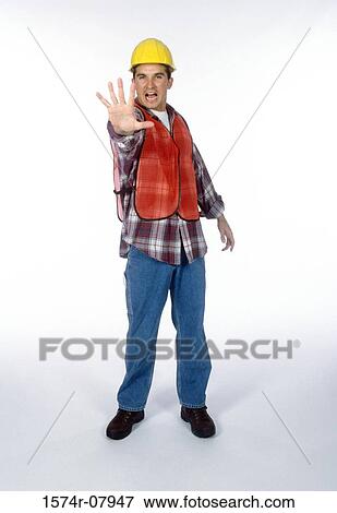 Stock Photo - Portrait of a construction worker holding his hand out. Fotosearch