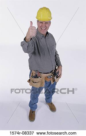 Portrait of a construction worker showing thumbs up sign View Large Photo Image Stock Photo - Portrait of a construction worker showing thumbs up sign. Fotosearch
