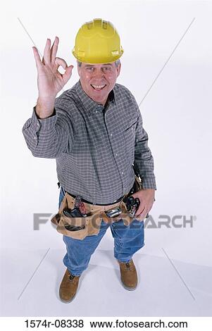 Portrait of a construction worker gesturing ok sign with his hand View Large Photo Image Stock Photo - Portrait of a construction worker gesturing ok sign with his hand. Fotosearch