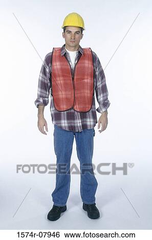Portrait of a construction worker standing View Large Photo Image Stock Photograph - Portrait of a construction worker standing. Fotosearch