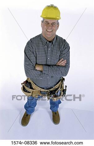Stock Photograph - Portrait of a construction worker smiling. Fotosearch