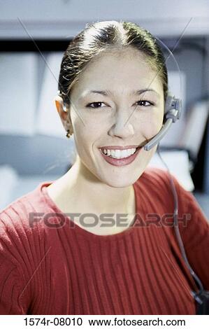 Portrait of a customer service representative wearing a headset View Large Photo Image Stock Image - Portrait of a customer service representative wearing a headset. Fotosearch
