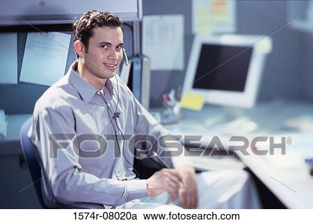 Stock Image - Portrait of a customer service representative wearing a headset. Fotosearch