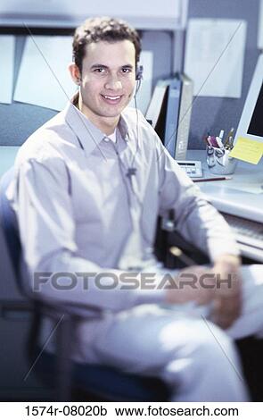 Portrait of a customer service representative wearing a headset View Large Photo Image Stock Image - Portrait of a customer service representative wearing a headset. Fotosearch