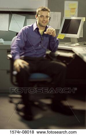 Portrait of a customer service representative wearing a headset View Large Photo Image Stock Photo - Portrait of a customer service representative wearing a headset. Fotosearch