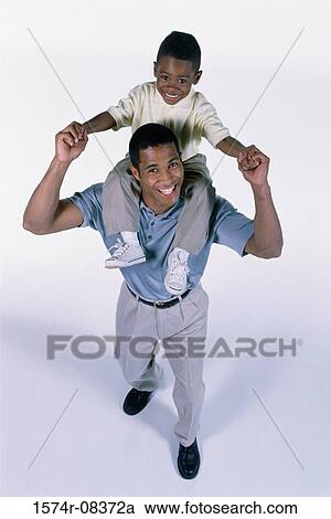 Portrait of a father carrying his son on his shoulders View Large Photo Image Stock Image - Portrait of a father carrying his son on his shoulders. Fotosearch