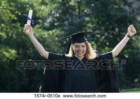 Stock Image - Portrait of a female graduate holding a diploma. Fotosearch