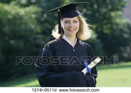 Stock Image - Portrait of a female graduate holding a diploma. Fotosearch