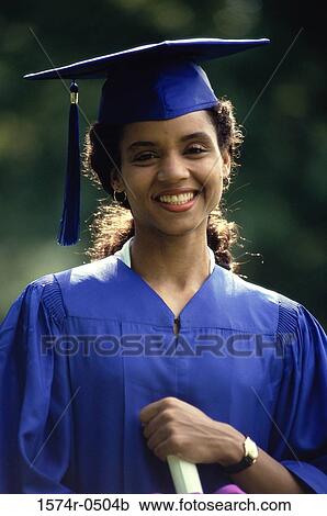 Stock Image - Portrait of a female graduate smiling. Fotosearch