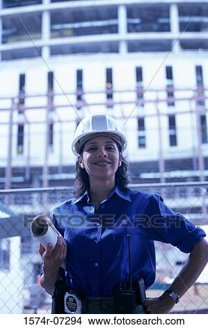 Portrait of a forewoman holding blueprints smiling View Large Photo Image Picture - Portrait of a forewoman holding blueprints smiling. Fotosearch