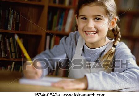 Portrait of a girl holding a pencil smiling View Large Photo Image Stock Image - Portrait of a girl holding a pencil smiling. Fotosearch