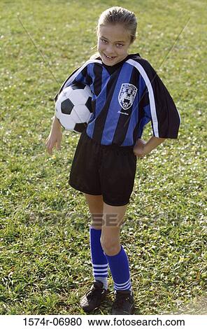 Portrait of a girl holding a soccer ball View Large Photo Image Stock Image - Portrait of a girl holding a soccer ball. Fotosearch