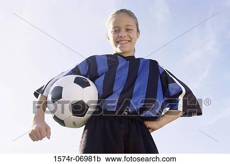 Portrait of a girl holding a soccer ball View Large Photo Image Stock Image - Portrait of a girl holding a soccer ball. Fotosearch