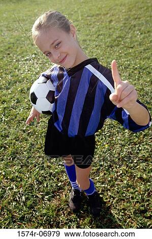 Stock Photo - Portrait of a girl holding a soccer ball. Fotosearch