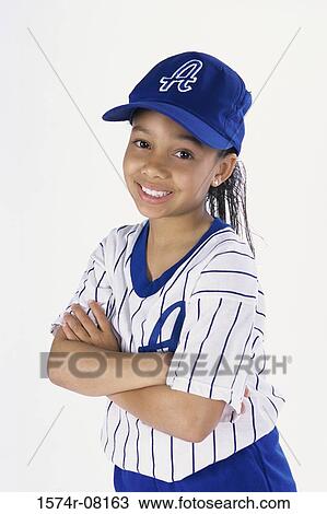 Stock Image - Portrait of a girl in a baseball uniform. Fotosearch