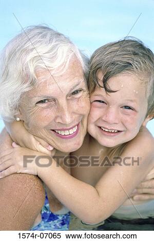 Stock Photography - Portrait of a grandmother holding her grandson. Fotosearch