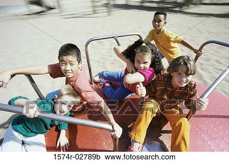 Portrait of a group of children sitting on a merry-go-round View Large Photo Image Stock Image - Portrait of a group of children sitting on a merry-go-round. Fotosearch