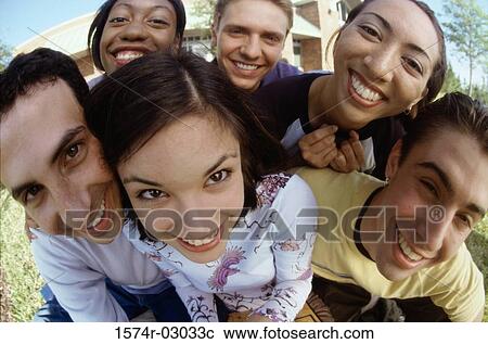 Stock Image - Portrait of a group of teenagers smiling. Fotosearch