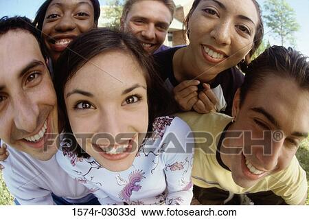 Stock Image - Portrait of a group of teenagers smiling. Fotosearch