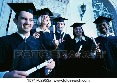 Portrait of a group of young graduates holding diplomas smiling View Large Photo Image Stock Image - Portrait of a group of young graduates holding diplomas smiling. Fotosearch