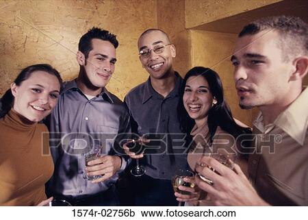 Portrait of a group of young people in a bar View Large Photo Image Stock Image - Portrait of a group of young people in a bar. Fotosearch