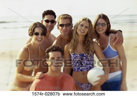 Portrait of a group of young people on the beach View Large Photo Image Stock Image - Portrait of a group of young people on the beach. Fotosearch