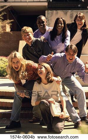 Portrait of a group of young people laughing View Large Photo Image Stock Image - Portrait of a group of young people laughing. Fotosearch