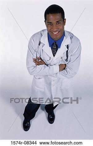 Portrait of a male doctor smiling View Large Photo Image Picture - Portrait of a male doctor smiling. Fotosearch