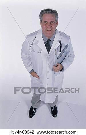 Portrait of a male doctor smiling View Large Photo Image Stock Image - Portrait of a male doctor smiling. Fotosearch