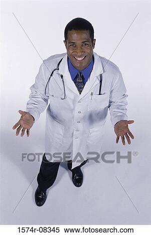 Stock Photography - Portrait of a male doctor smiling. Fotosearch