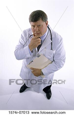 Stock Image - Portrait of a male doctor with a stethoscope around his neck. Fotosearch