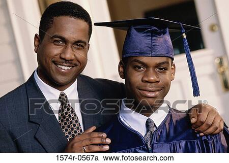 Portrait of a male graduate with his father View Large Photo Image Stock Image - Portrait of a male graduate with his father. Fotosearch
