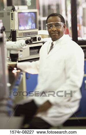 Portrait of a male researcher working in a laboratory View Large Photo Image Stock Photo - Portrait of a male researcher working in a laboratory. Fotosearch