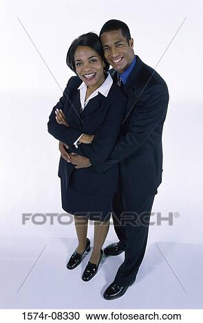 Portrait of a mid adult couple standing together View Large Photo Image Stock Image - Portrait of a mid adult couple standing together. Fotosearch