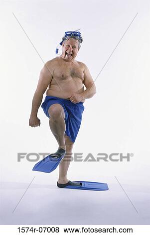 Portrait of a mid adult man in shorts wearing flippers with a mask and a snorkel View Large Photo Image Stock Photo - Portrait of a mid adult man in shorts wearing flippers with a mask and a snorkel. Fotosearch