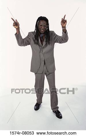 Portrait of a mid adult man with his arm raised View Large Photo Image Stock Image - Portrait of a mid adult man with his arm raised. Fotosearch