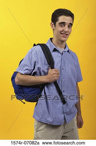 Stock Image - Portrait of a teenage boy carrying a backpack. Fotosearch