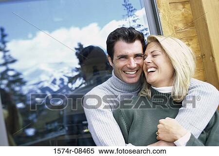 Stock Photography - Portrait of a young couple smiling. Fotosearch
