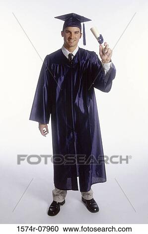 Portrait of a young male graduate holding a diploma View Large Photo Image Stock Image - Portrait of a young male graduate holding a diploma. Fotosearch