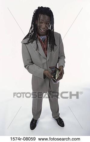Stock Photo - Portrait of a young man holding his wallet. Fotosearch