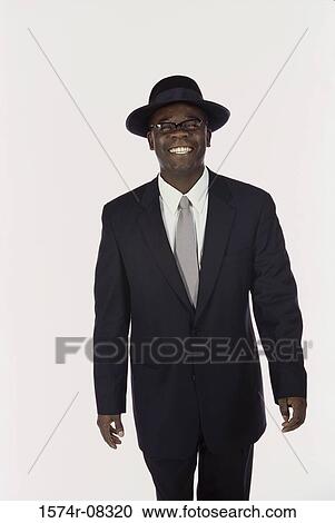 Portrait of a young man wearing a hat View Large Photo Image Stock Image - Portrait of a young man wearing a hat. Fotosearch