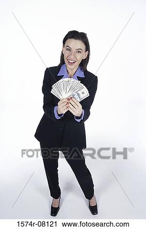 Portrait of a young woman holding paper money View Large Photo Image Stock Image - Portrait of a young woman holding paper money. Fotosearch