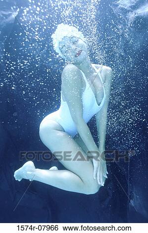 Portrait of a young woman underwater View Large Photo Image Stock Photograph - Portrait of a young woman underwater. Fotosearch