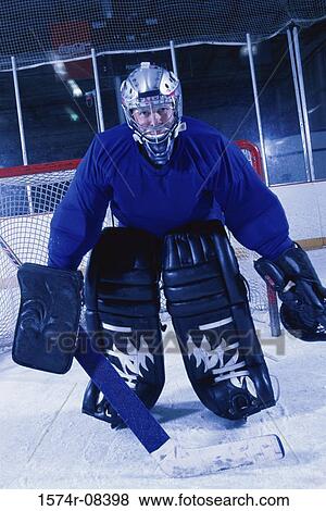 Portrait of an ice hockey goalkeeper View Large Photo Image Stock Photo - Portrait of an ice hockey goalkeeper. Fotosearch